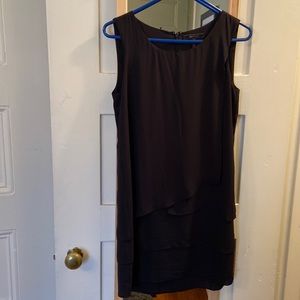 Simple black dress with asymmetrical detail